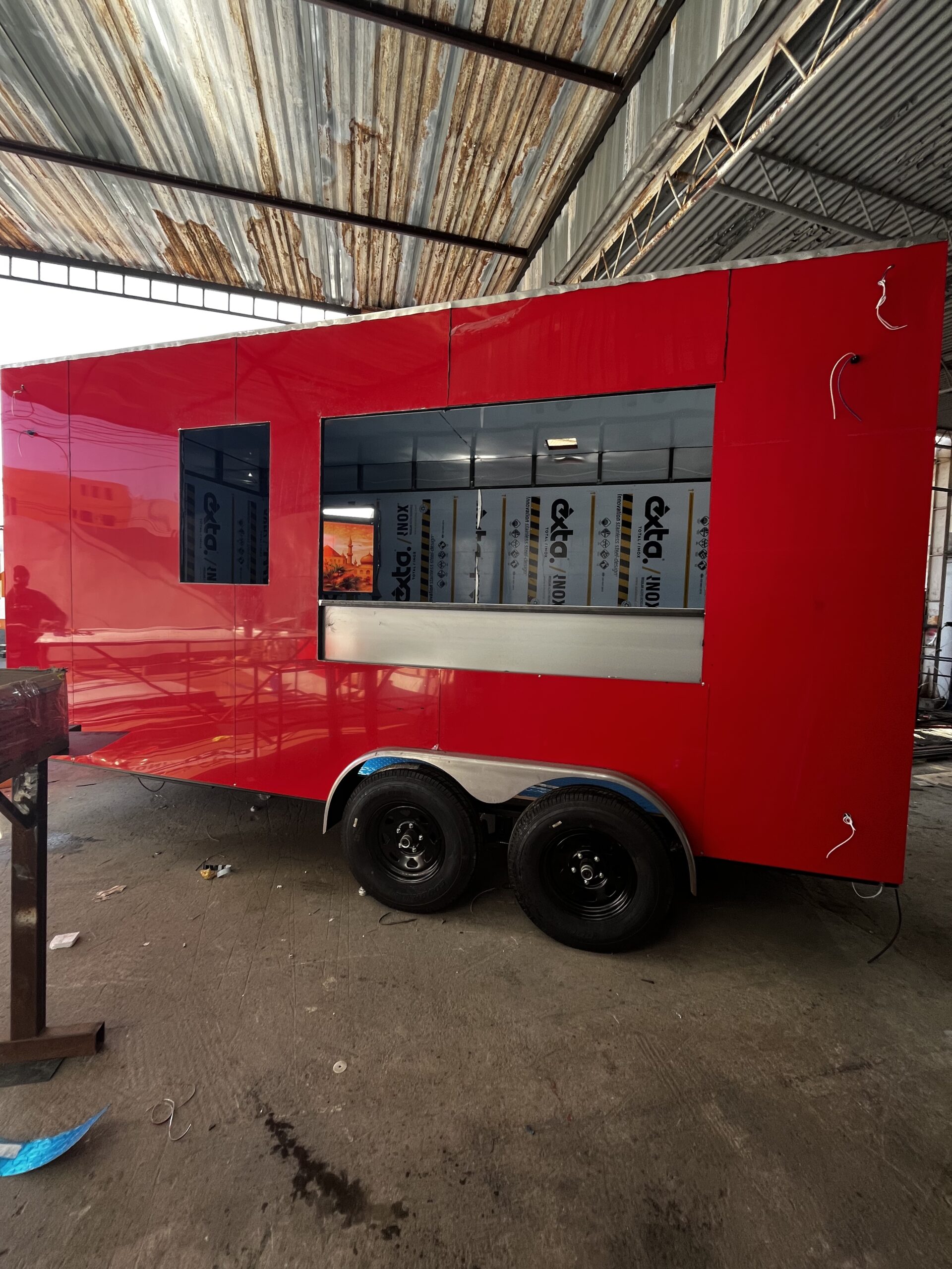 Red trailer exterior in shop